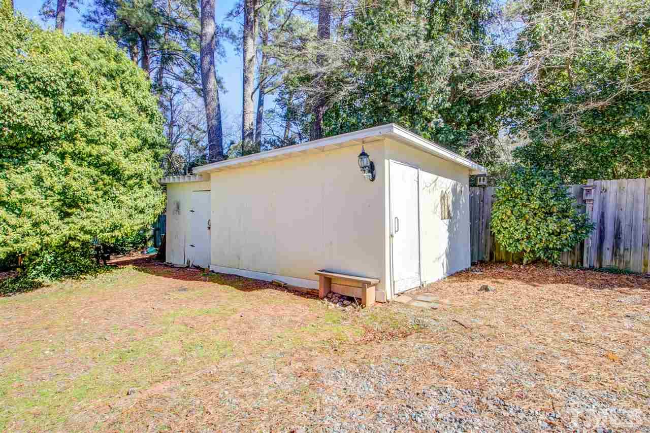 3424 Wade Avenue Raleigh, NC 27607 - Photo 29 of 30 a backyard of a house with a tree