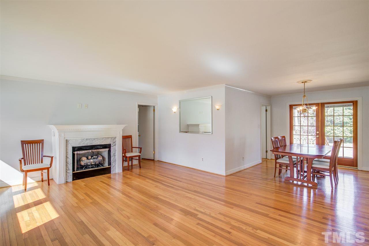 3424 Wade Avenue Raleigh, NC 27607 - Photo 4 of 30 a living room with furniture and a fireplace