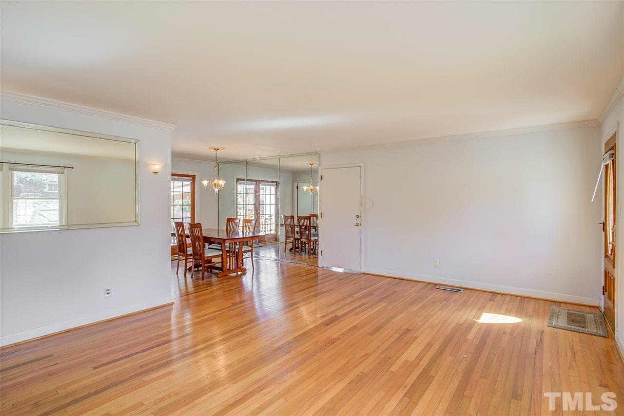 3424 Wade Avenue Raleigh, NC 27607 - Photo 5 of 30 an empty room with wooden floor and a window