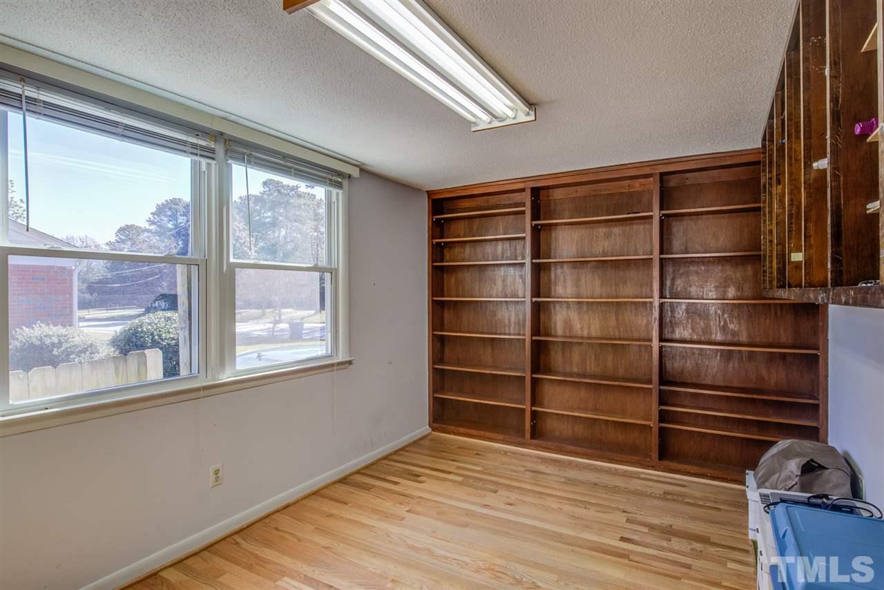3424 Wade Avenue Raleigh, NC 27607 - Photo 6 of 30 a view of a room with wooden floor and windows