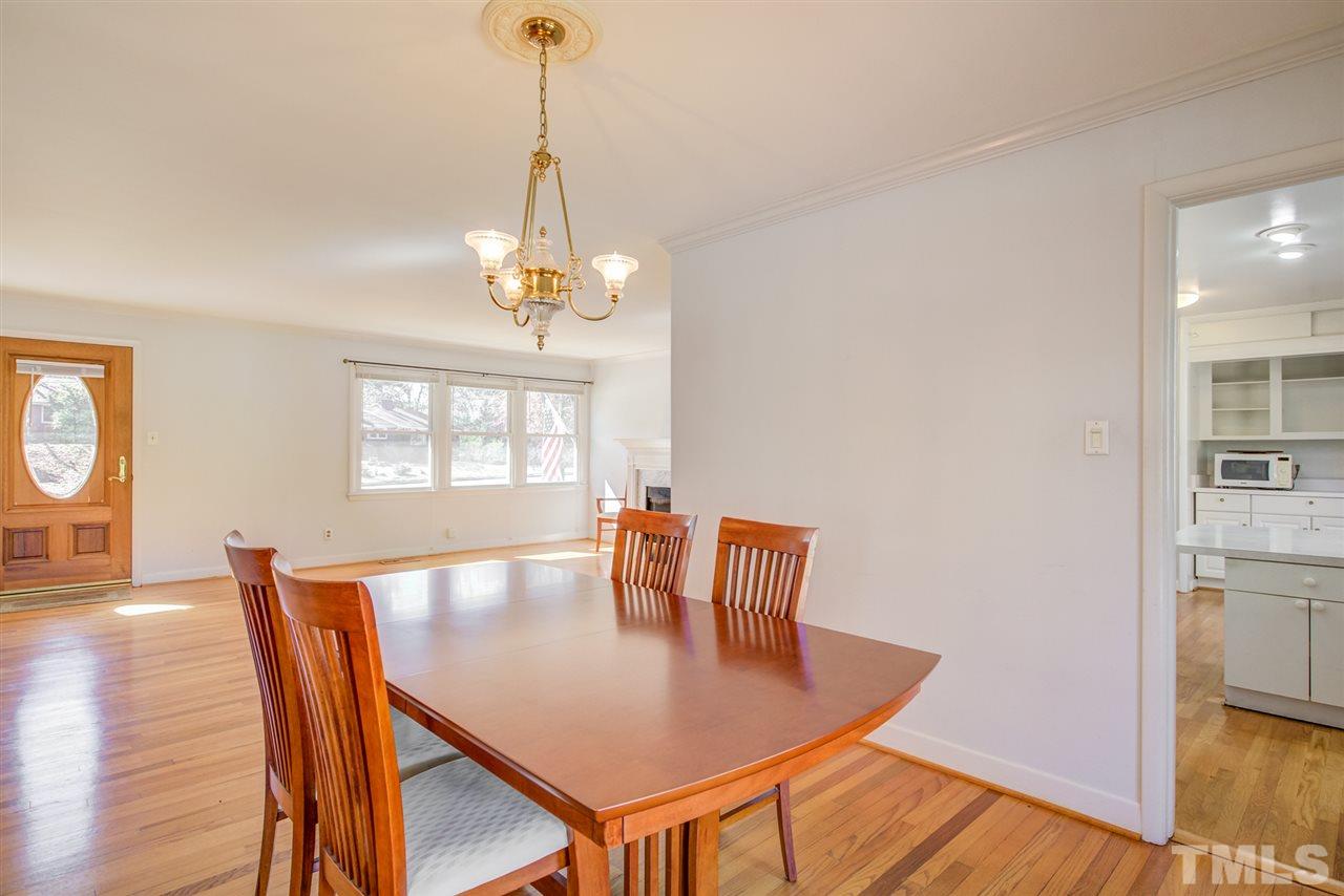 3424 Wade Avenue Raleigh, NC 27607 - Photo 9 of 30 a view of a dining room with furniture window and wooden floor