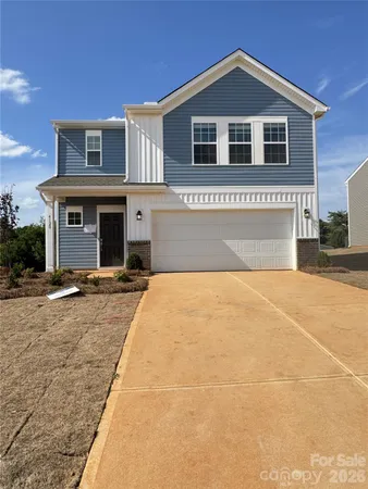 a front view of a house with yard
