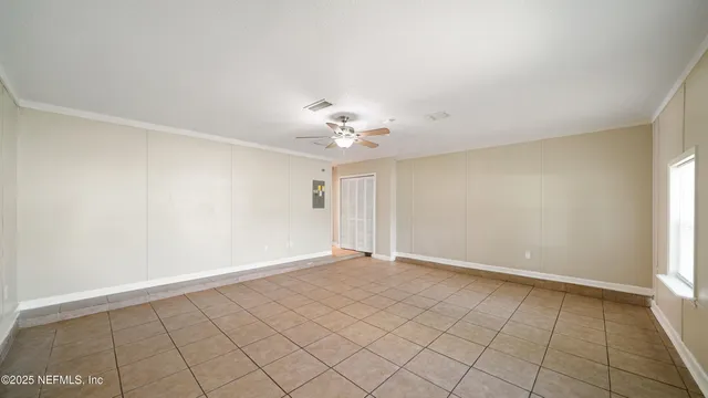 a view of an empty room with a window