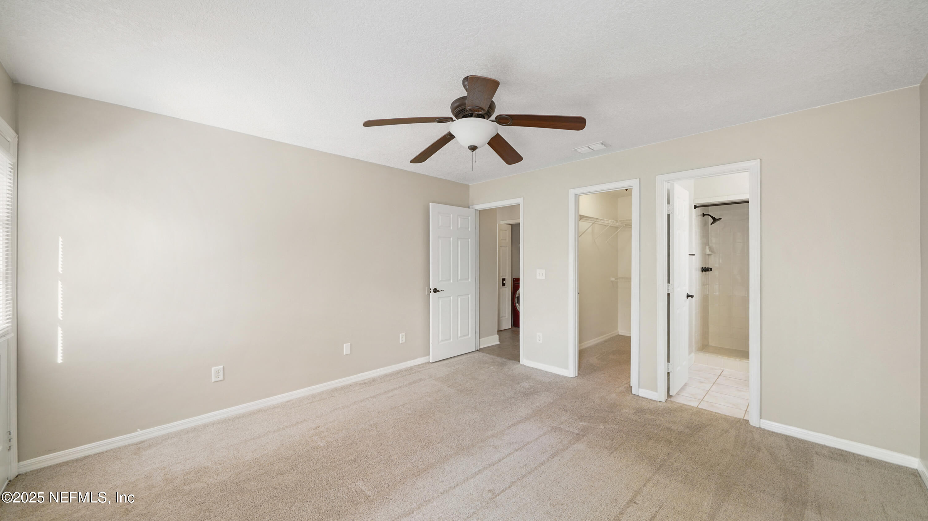 3255 Dowitcher Lane Orange Park, FL 32065 - Photo 15 of 27 a view of a chandelier fan and closet in a room