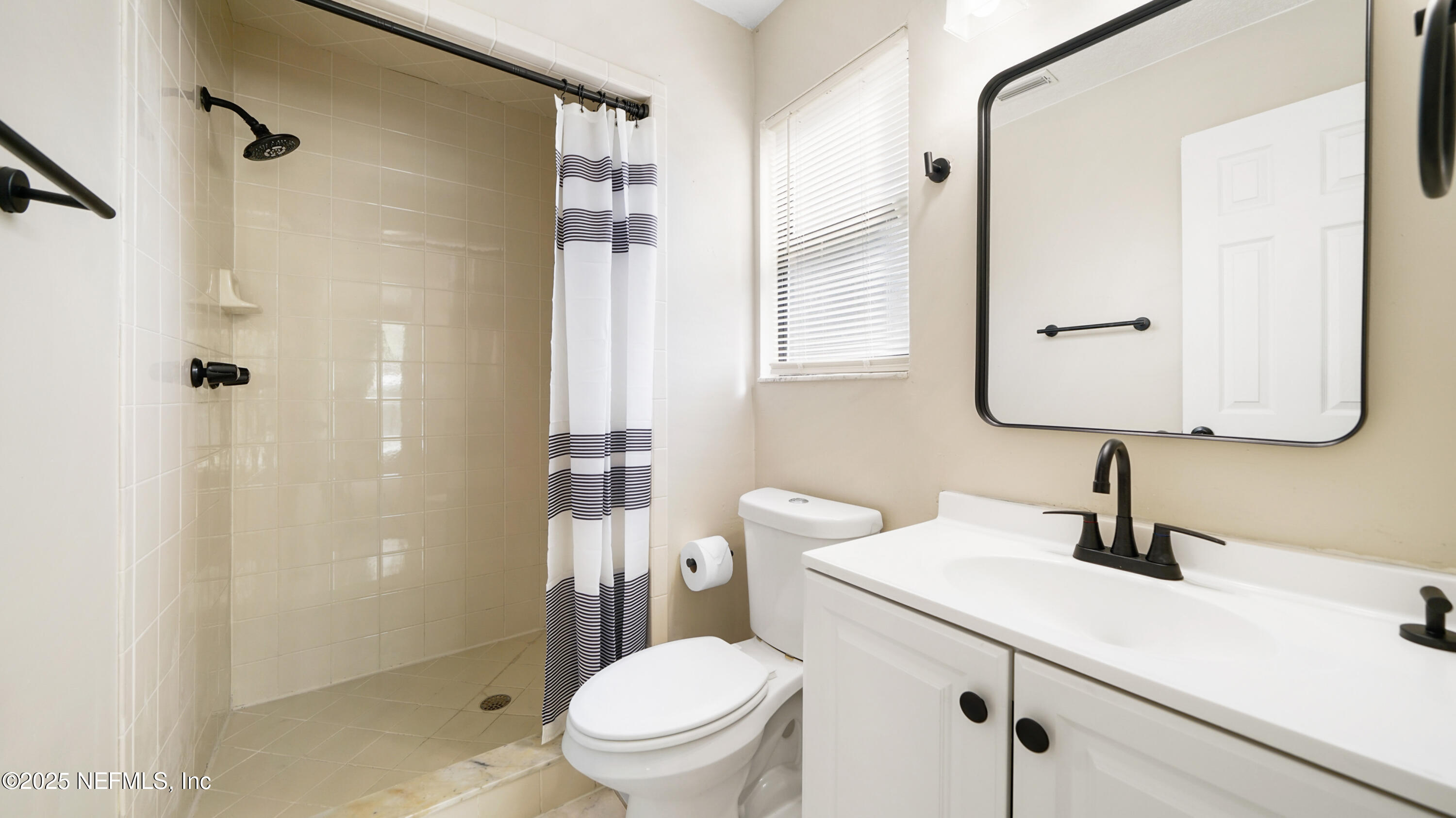 3255 Dowitcher Lane Orange Park, FL 32065 - Photo 16 of 27 a bathroom with a sink a toilet and shower