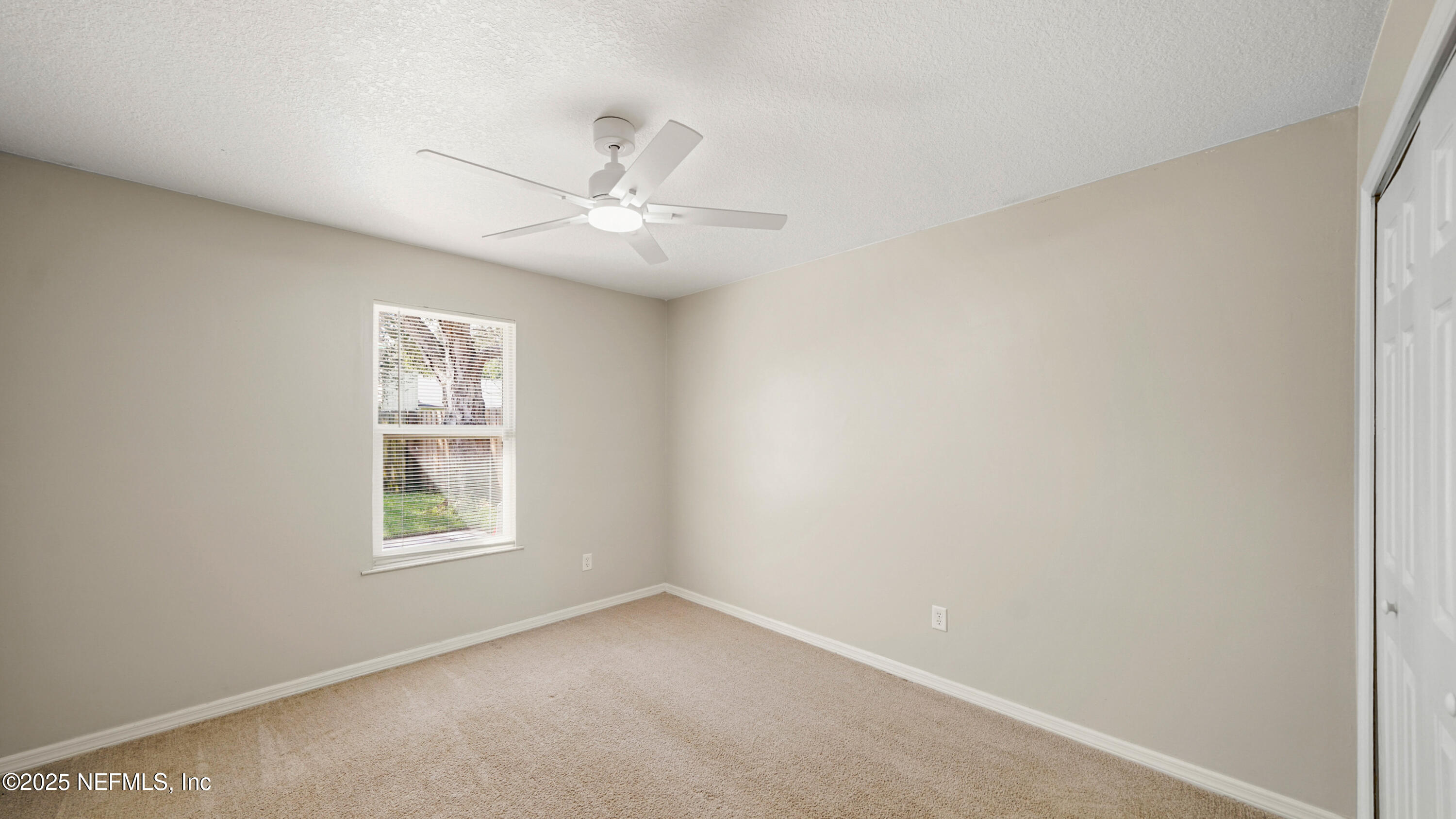 3255 Dowitcher Lane Orange Park, FL 32065 - Photo 17 of 27 an empty room with windows and fan