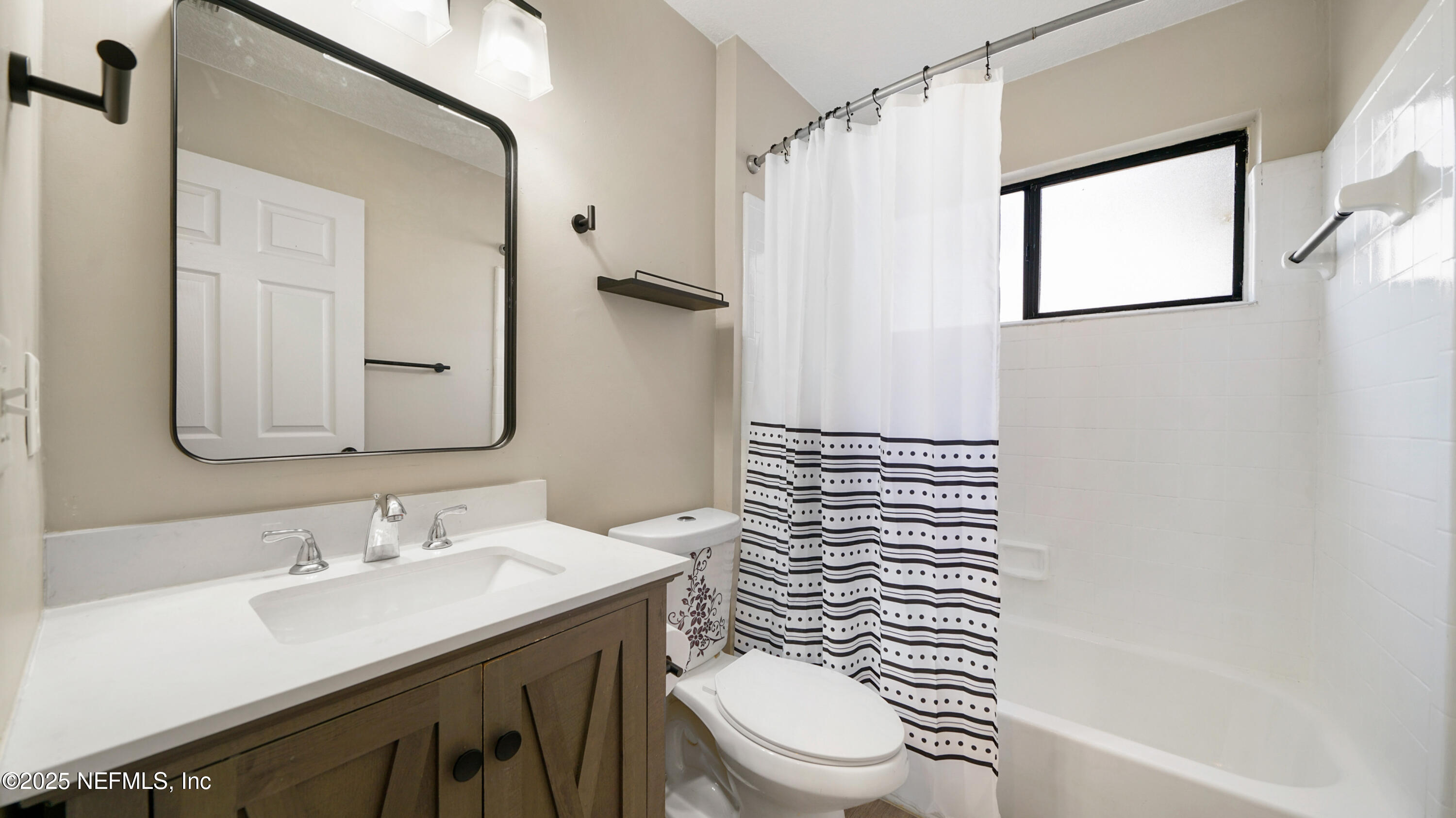 3255 Dowitcher Lane Orange Park, FL 32065 - Photo 18 of 27 a bathroom with a sink a toilet and shower