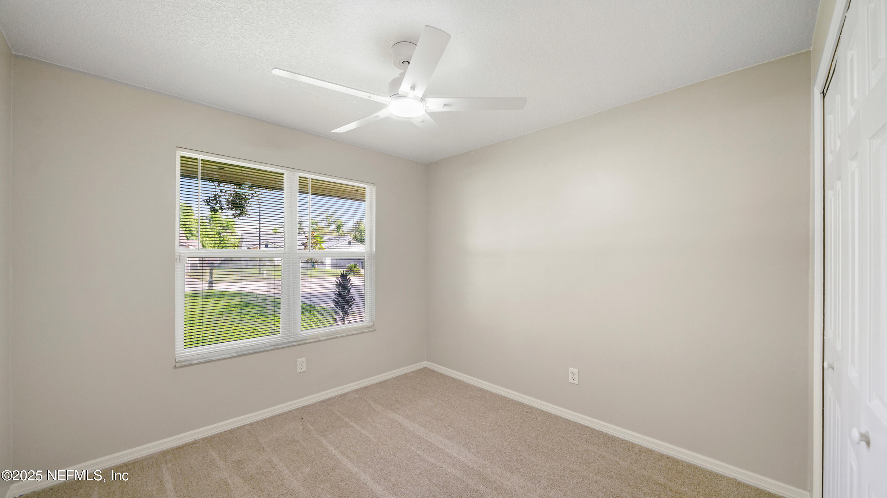 3255 Dowitcher Lane Orange Park, FL 32065 - Photo 20 of 27 an empty room with windows and closet