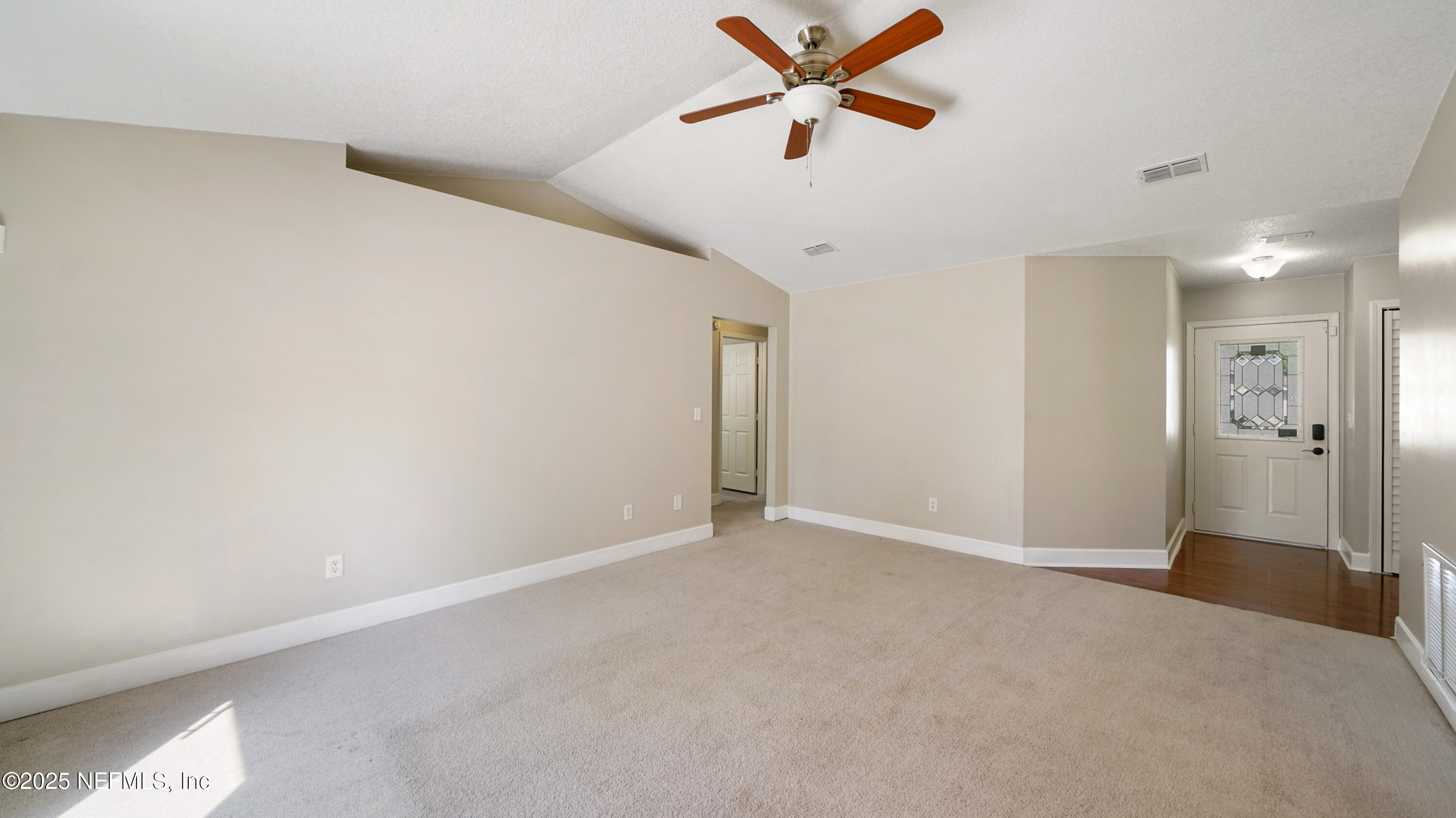 3255 Dowitcher Lane Orange Park, FL 32065 - Photo 8 of 27 a view of a livingroom with a ceiling fan