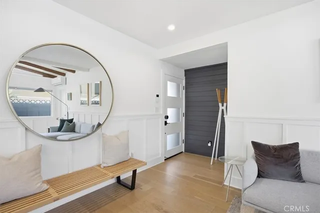 a view of livingroom with furniture and mirror