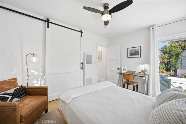 a bedroom with a bed and a couch