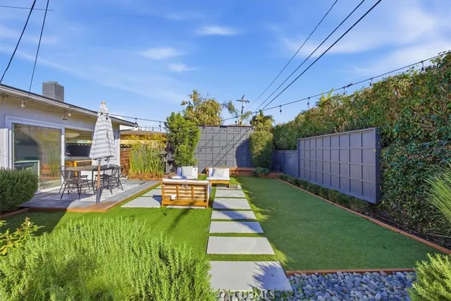 a view of yard with patio