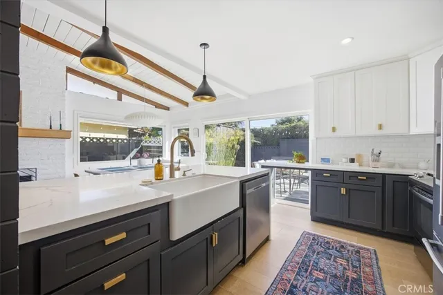 a kitchen with a sink cabinets and window