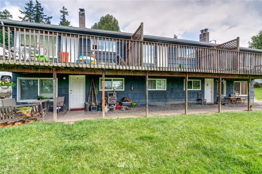 19215 98th Avenue South Renton, WA 98055 - Photo 5 of 23 a view of a chair and tables in the deck and a backyard