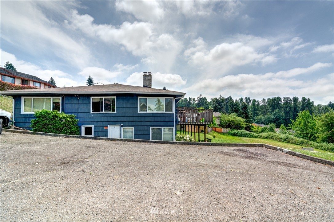 19215 98th Avenue South Renton, WA 98055 - Photo 7 of 23 a view of an house with backyard space and balcony