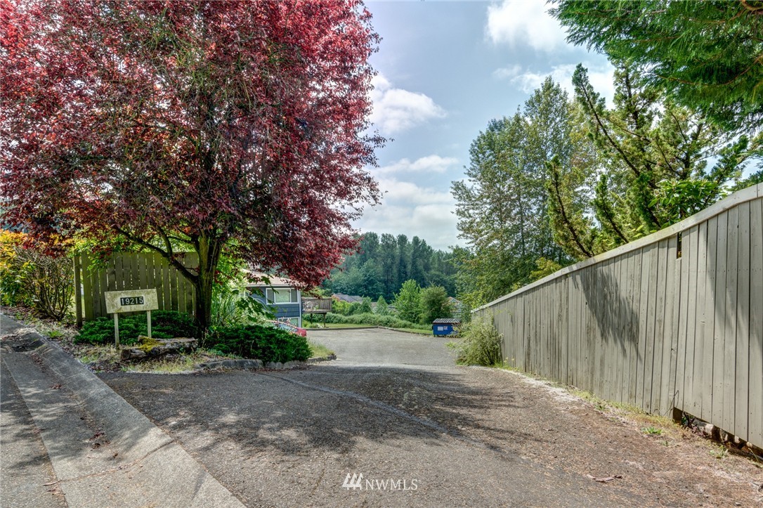 19215 98th Avenue South Renton, WA 98055 - Photo 8 of 23 a view of a street with a trees