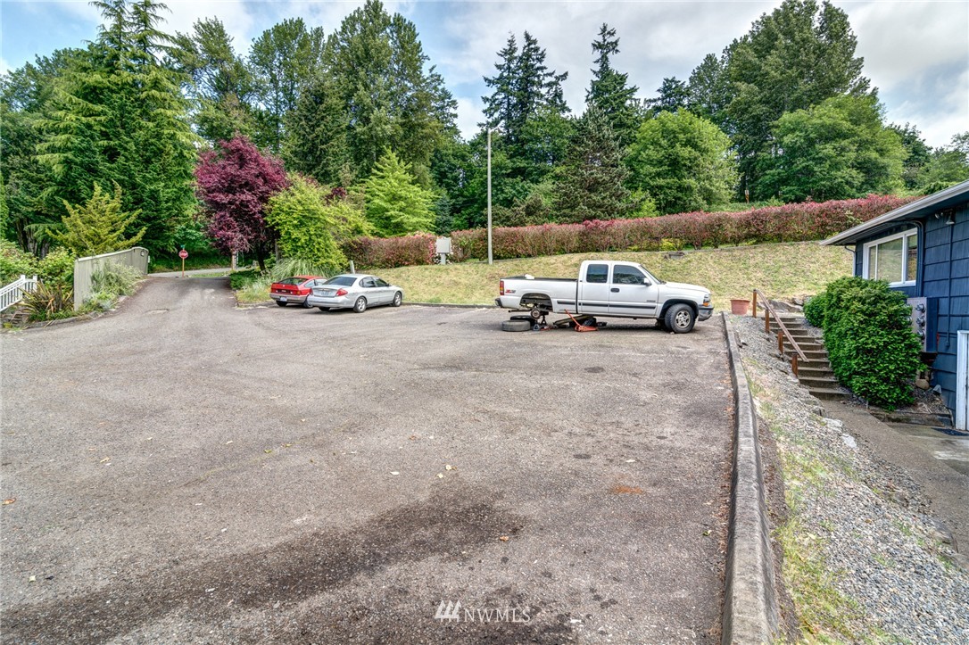 19215 98th Avenue South Renton, WA 98055 - Photo 9 of 23 a view of backyard with a table and chairs and potted plants