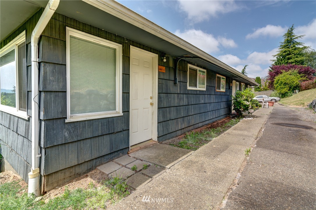 19215 98th Avenue South Renton, WA 98055 - Photo 10 of 23 a front view of a house with a yard