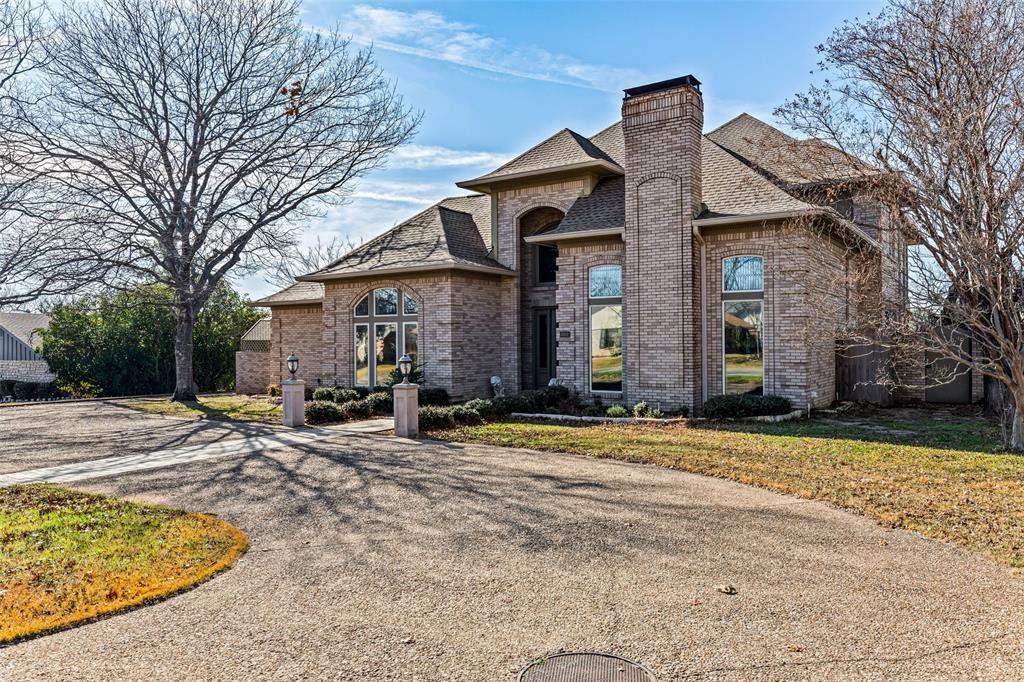 8908 Brierfield Road Granbury, TX 76049 - Photo 2 of 40 a front view of a house with swimming pool and porch