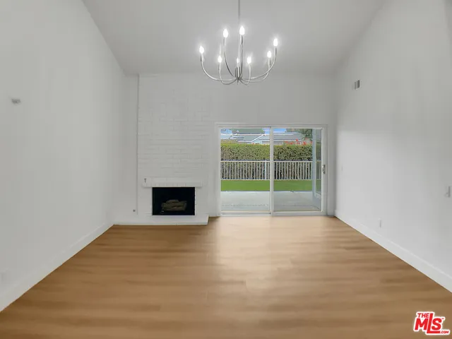 a view of a room with a large window