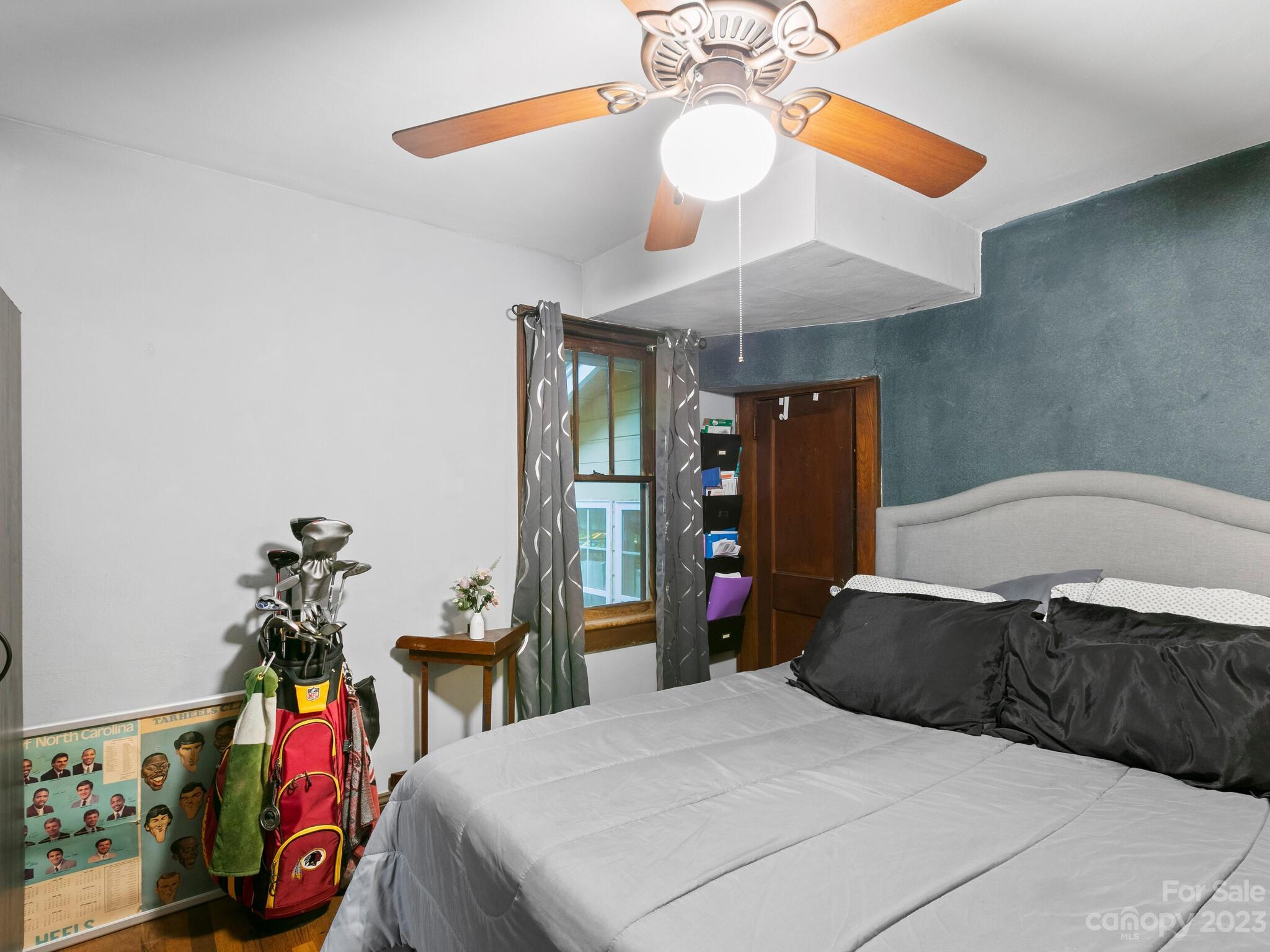 11 Hale Road Clyde, NC 28721 - Photo 17 of 25 a bedroom with a bed and a chandelier