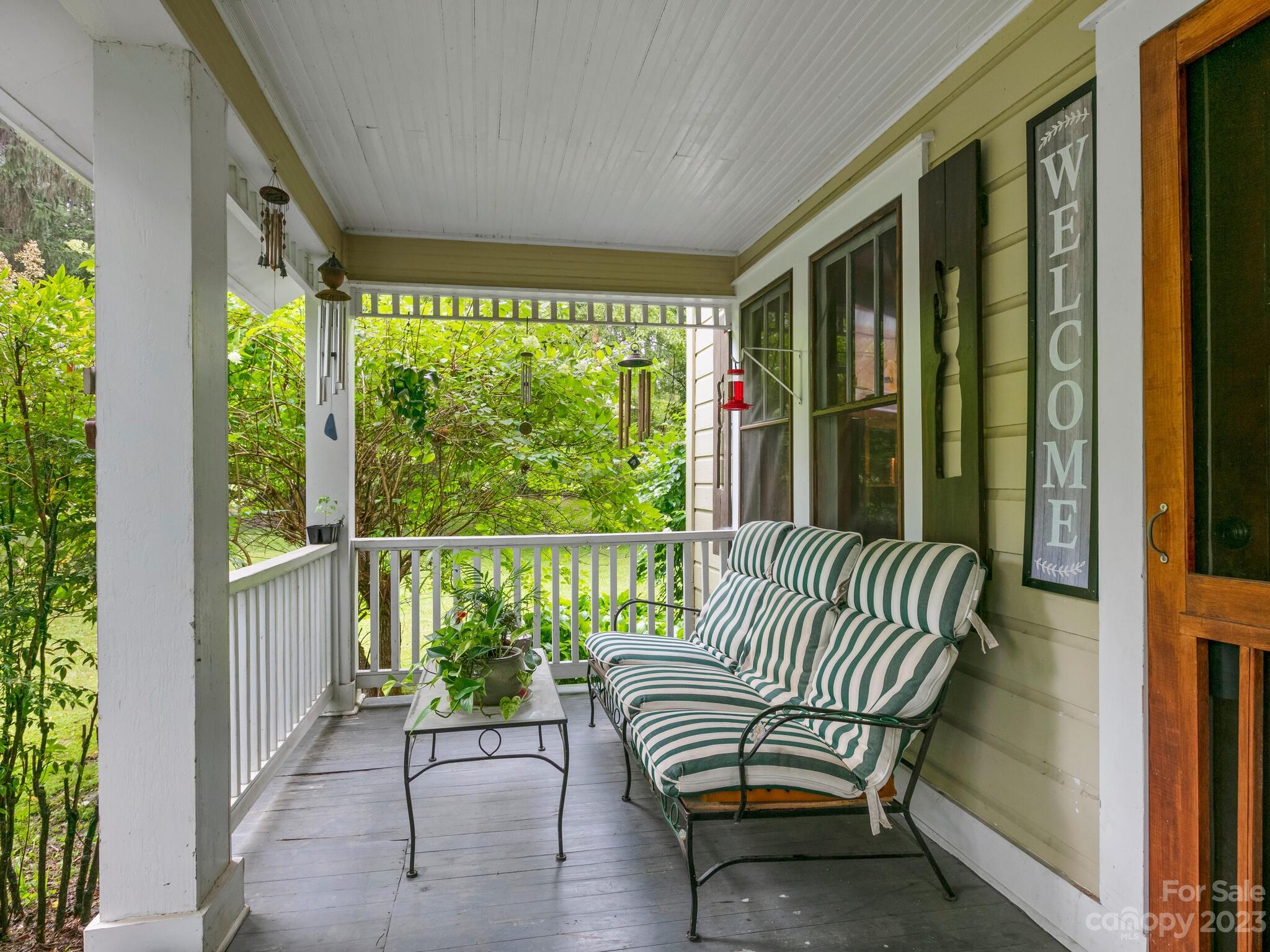 11 Hale Road Clyde, NC 28721 - Photo 5 of 25 a balcony with couple of chairs and a couch