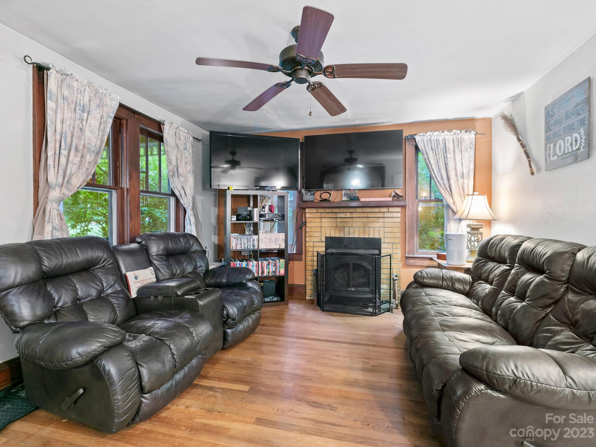 11 Hale Road Clyde, NC 28721 - Photo 6 of 25 a living room with furniture fireplace and flat screen tv