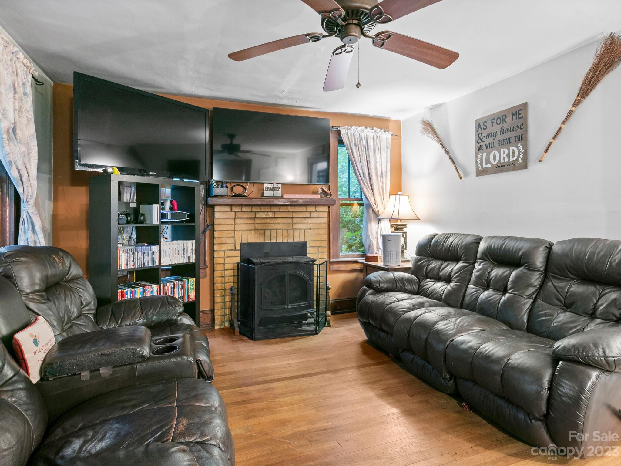 11 Hale Road Clyde, NC 28721 - Photo 7 of 25 a living room with furniture and a fireplace