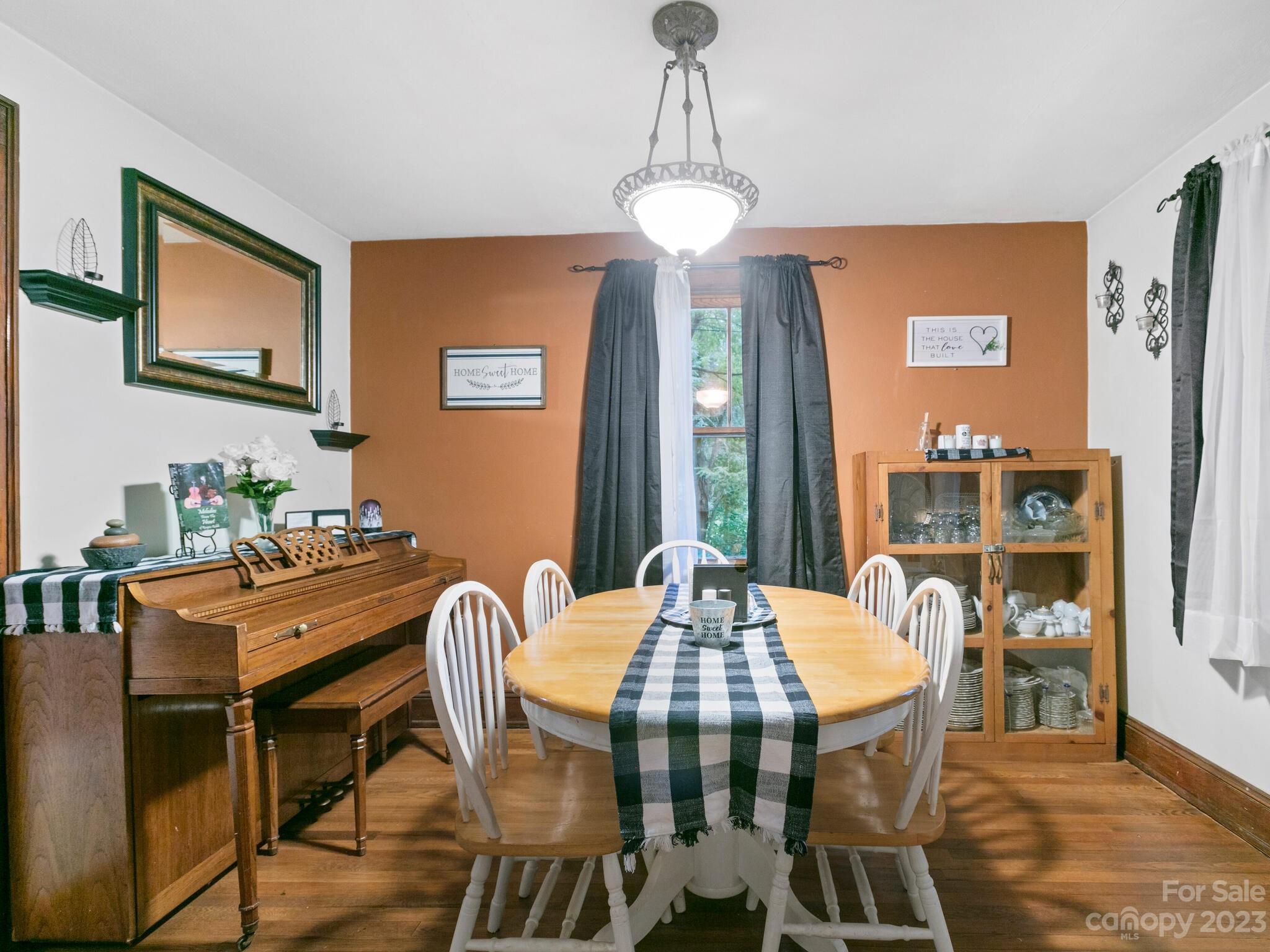 11 Hale Road Clyde, NC 28721 - Photo 10 of 25 a view of a dining room with furniture window and wooden floor