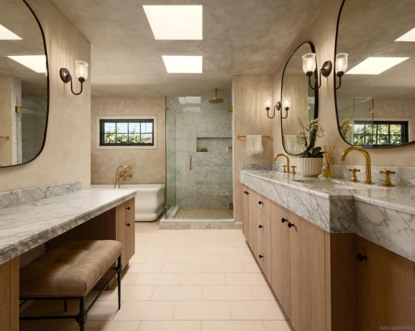 a bathroom with a bathtub and a shower