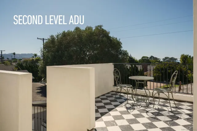 a bathroom with a granite countertop sink a mirror and a shower