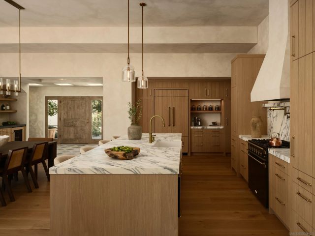 a kitchen with a stove and a refrigerator