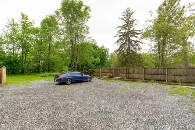 a view of a park with large trees