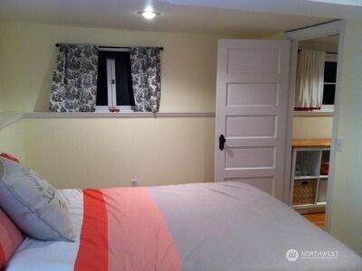 342 16th Avenue East Seattle, WA 98112 - Photo 11 of 11 a bedroom with a bed and a window