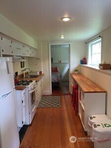 342 16th Avenue East Seattle, WA 98112 - Photo 6 of 11 a kitchen with a sink and a stove top oven