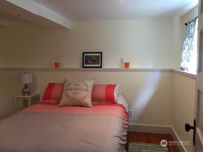 342 16th Avenue East Seattle, WA 98112 - Photo 8 of 11 a bedroom with a bed and a window