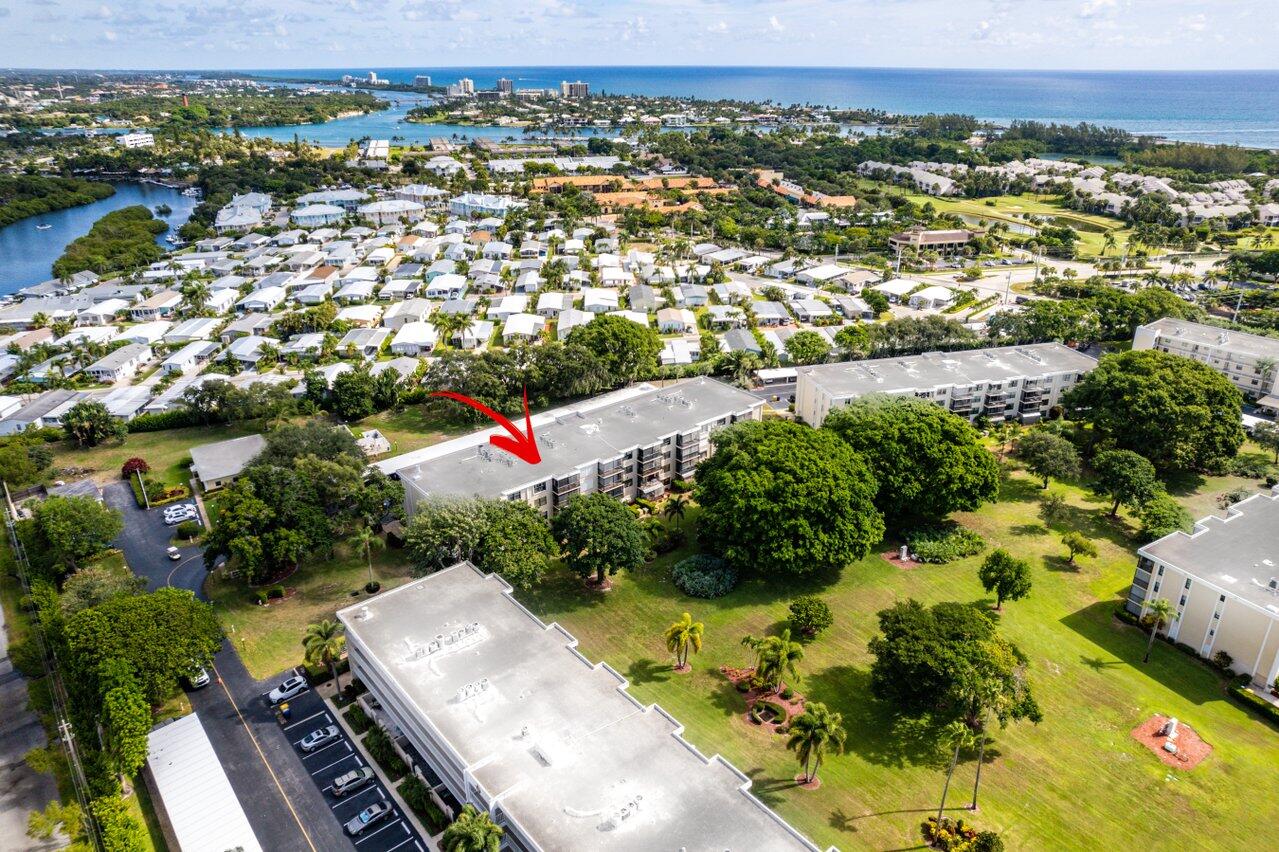 300 North Hwy A1A, Unit 104O Jupiter, FL 33477 - Photo 21 of 25 an aerial view of residential houses with outdoor space