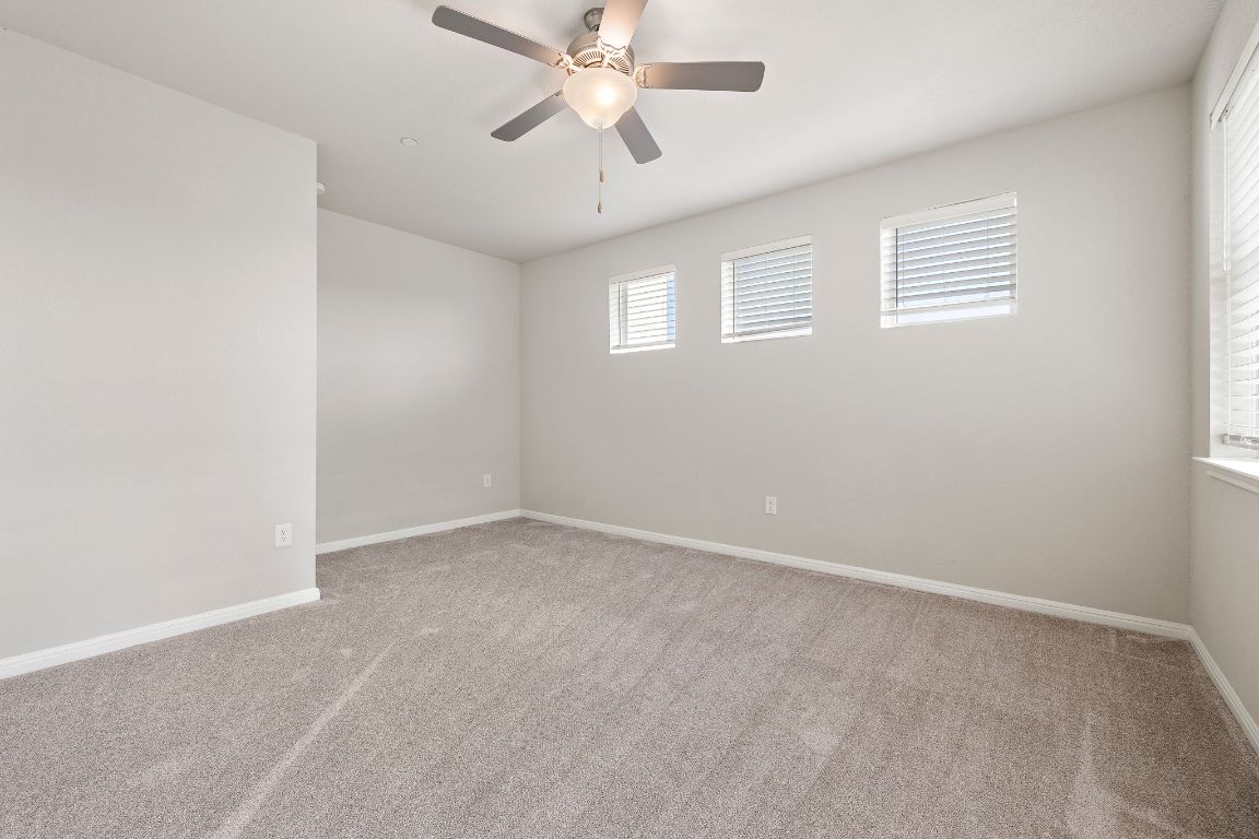 9015 Cattle Baron Path, Unit 504 Austin, TX 78747 - Photo 14 of 36 a view of an empty room with a window