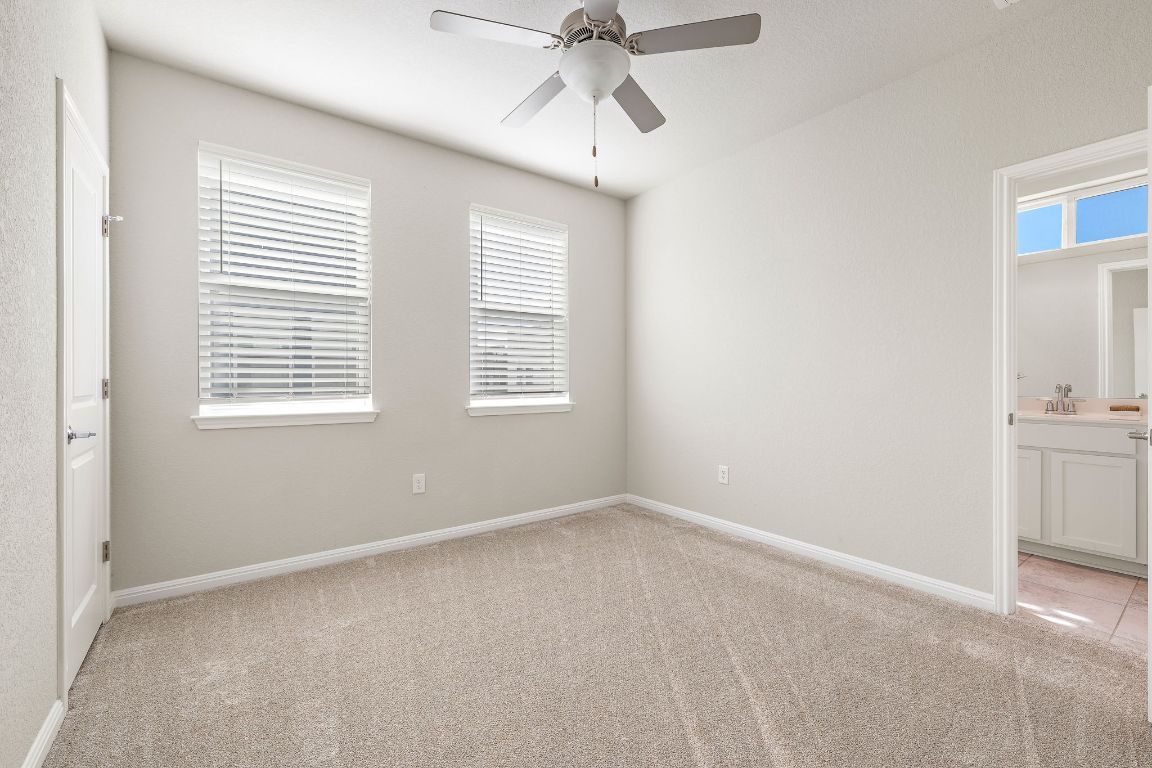 9015 Cattle Baron Path, Unit 504 Austin, TX 78747 - Photo 18 of 36 a view of an empty room with a window