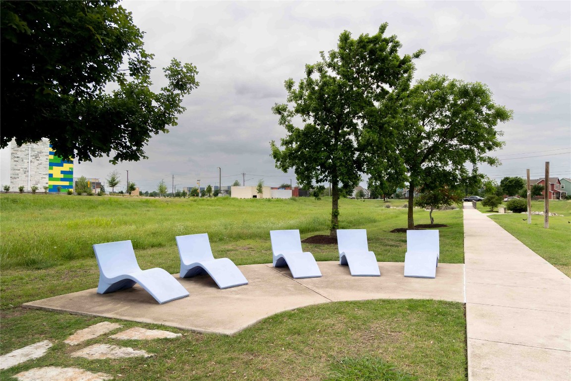 9015 Cattle Baron Path, Unit 504 Austin, TX 78747 - Photo 26 of 36 a view of a garden with sitting area