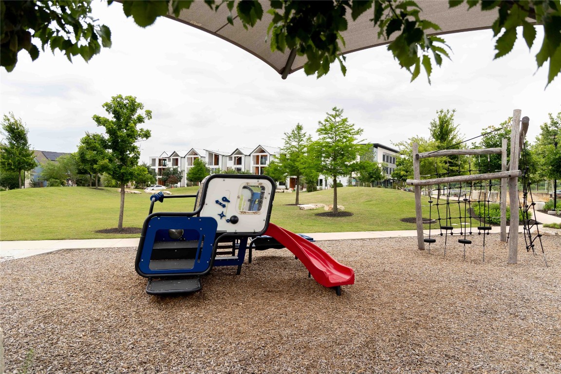 9015 Cattle Baron Path, Unit 504 Austin, TX 78747 - Photo 34 of 36 an outdoor space with furniture and garden