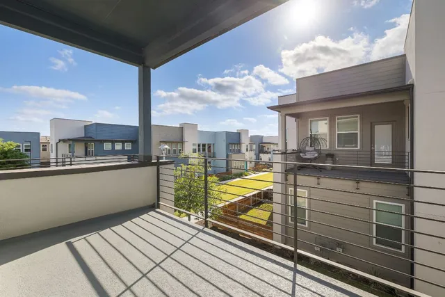 a view of a balcony with swimming pool