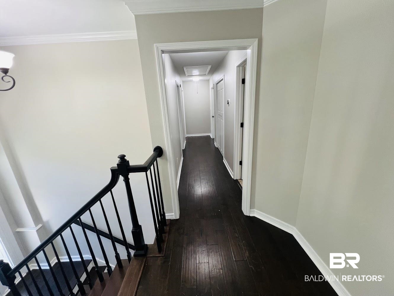 266 Ridgewood Drive Daphne, AL 36526 - Photo 10 of 34 Wood-finish flooring throughout the hallway and staircase