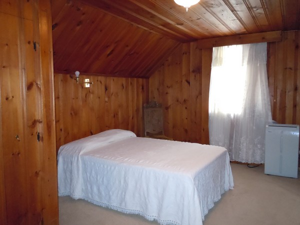 155 Carnavon Circle Springfield, MA 01109 - Photo 14 of 18 a bed sitting in a spacious bedroom next to a window