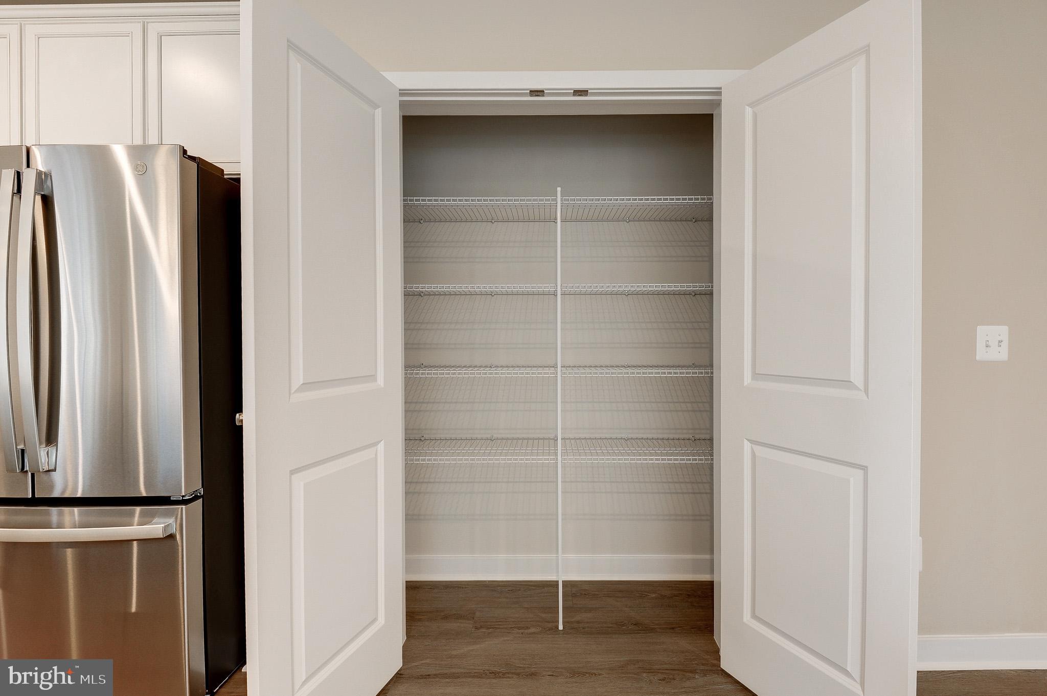 4395 Peach Lily Lane, Unit 304 Chantilly, VA 20151 - Photo 12 of 36 a view of walk in closet with empty racks