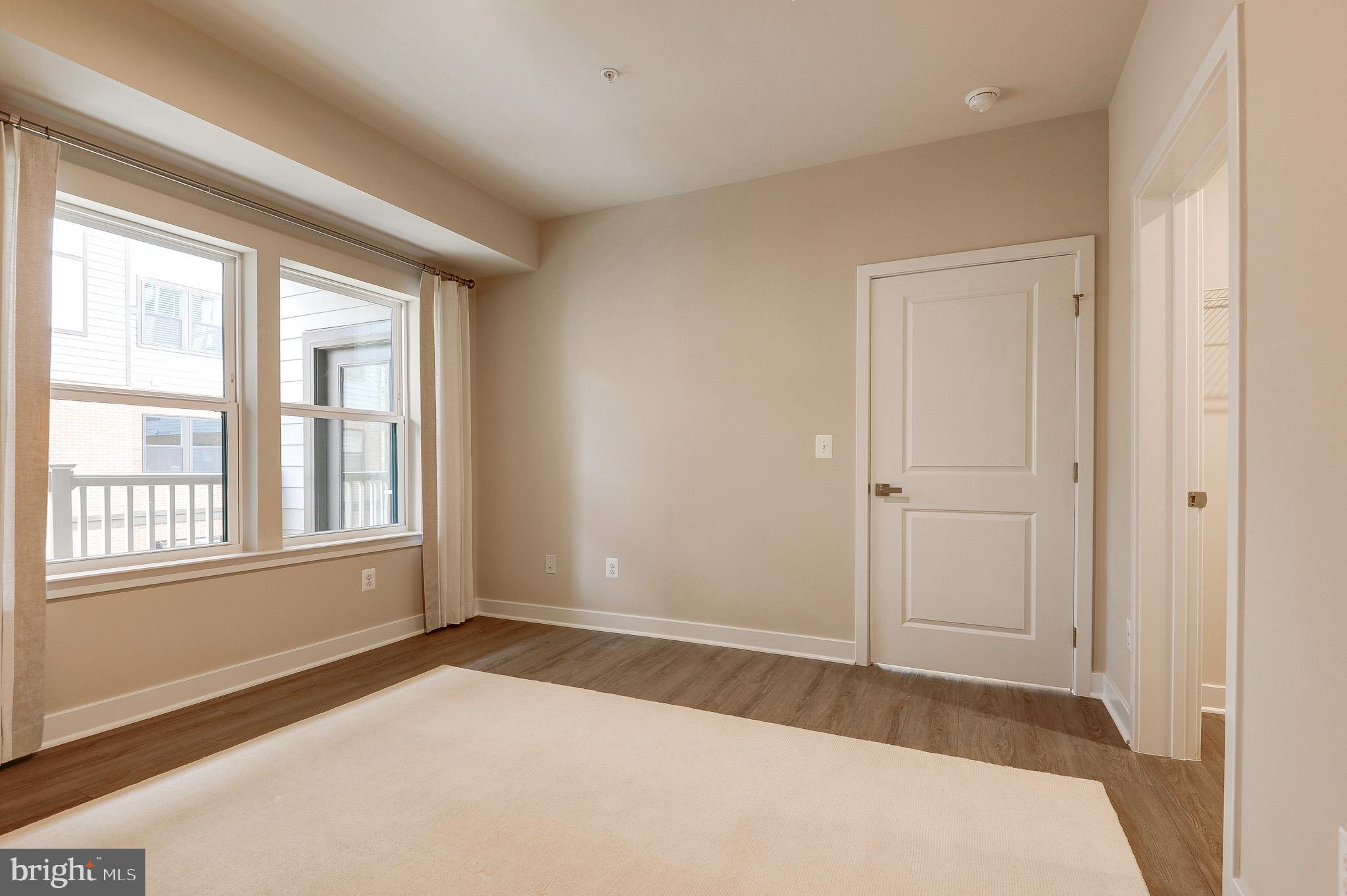 4395 Peach Lily Lane, Unit 304 Chantilly, VA 20151 - Photo 14 of 36 a view of an empty room with a window