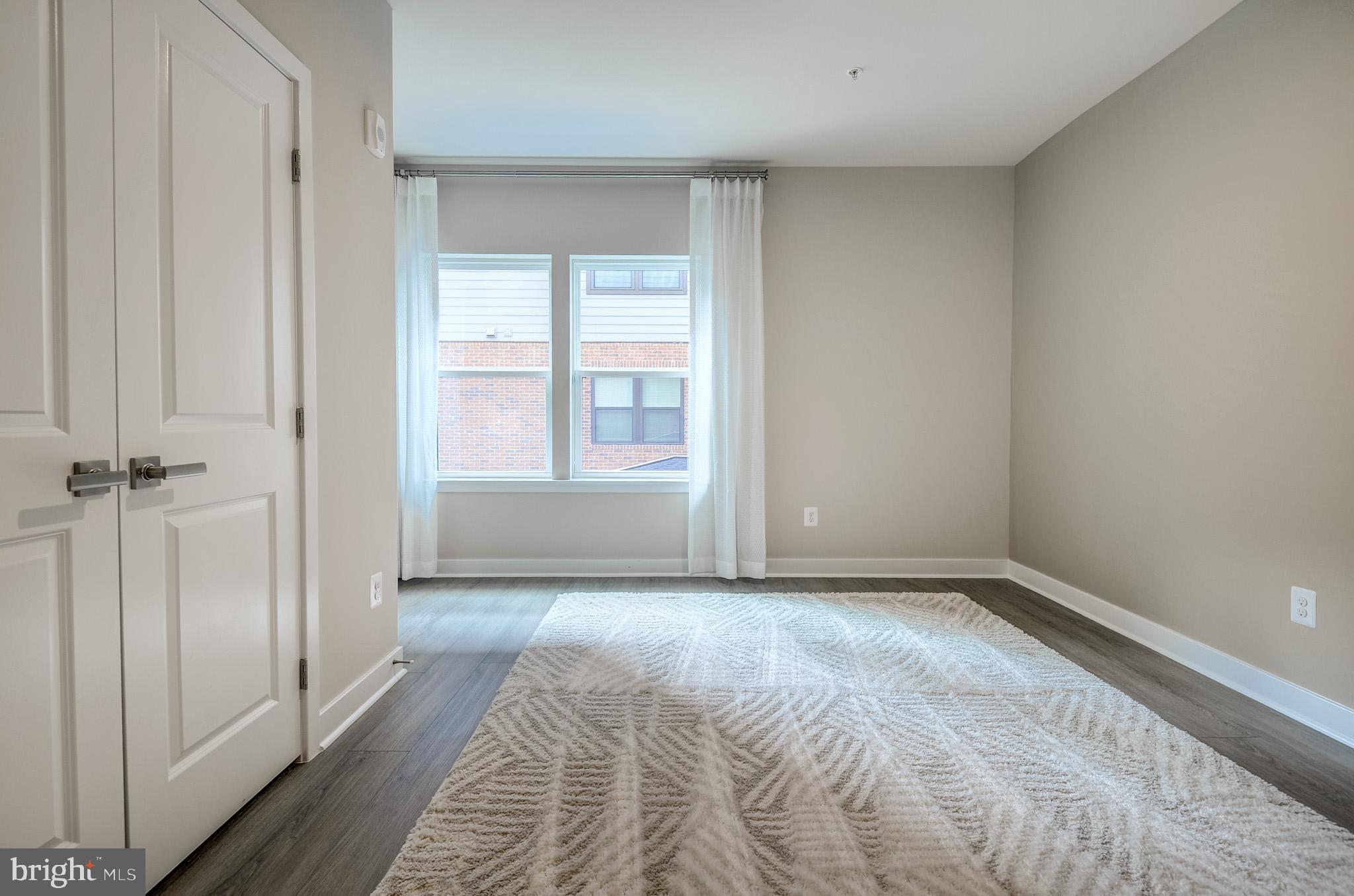 4395 Peach Lily Lane, Unit 304 Chantilly, VA 20151 - Photo 20 of 36 a view of an empty room with a window