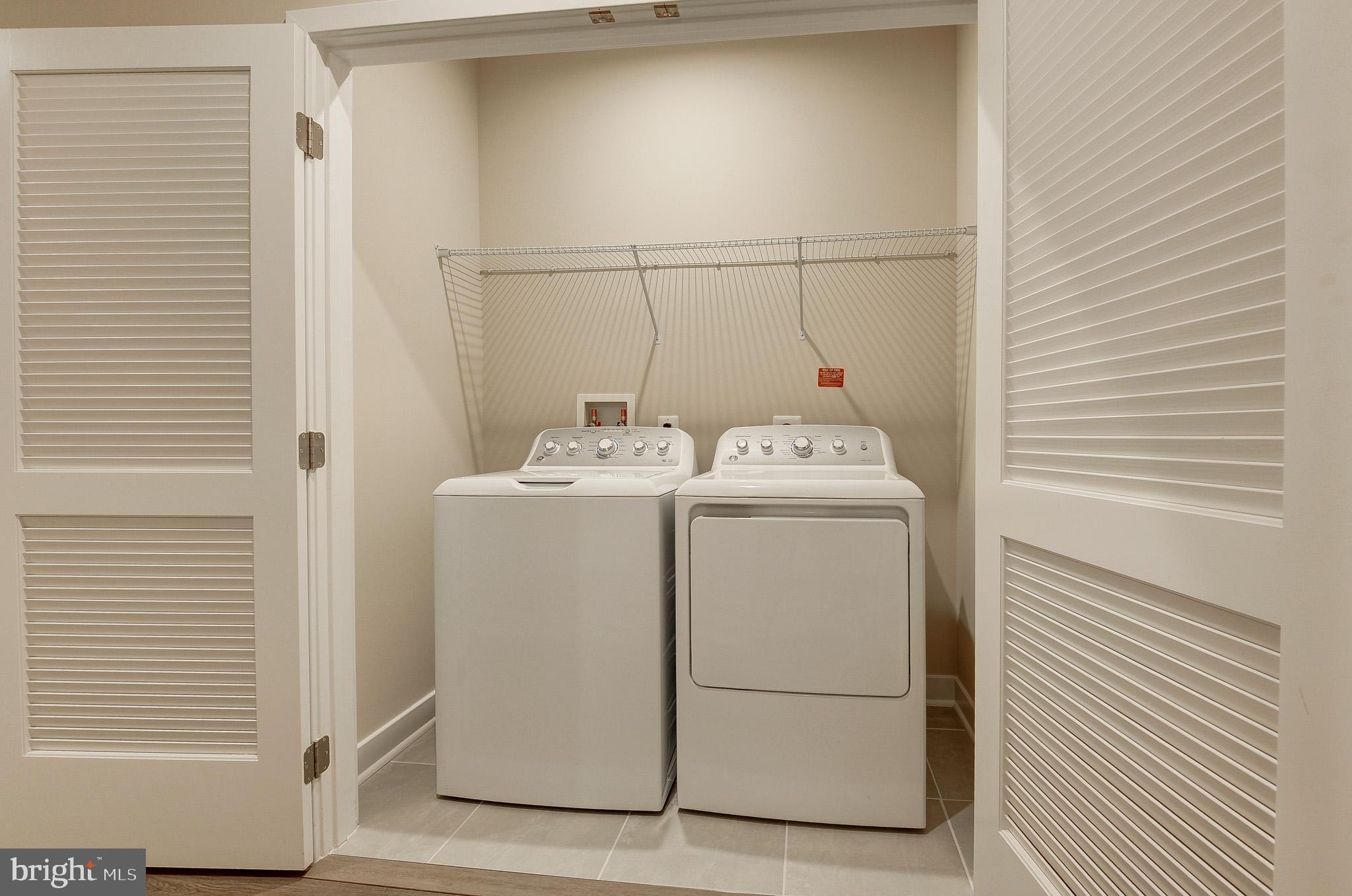 4395 Peach Lily Lane, Unit 304 Chantilly, VA 20151 - Photo 25 of 36 a utility room with dryer and washer