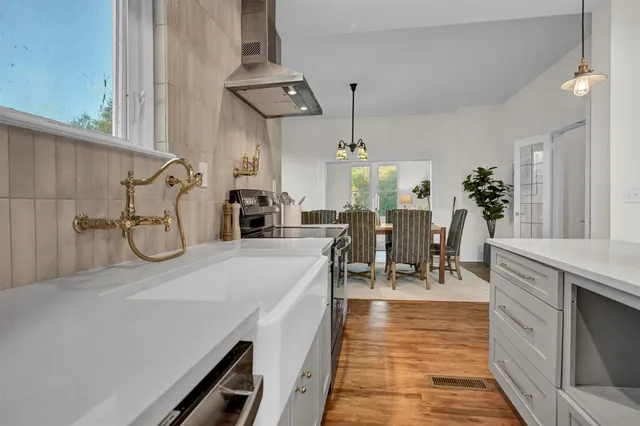a very nice looking dining room with a table and chairs