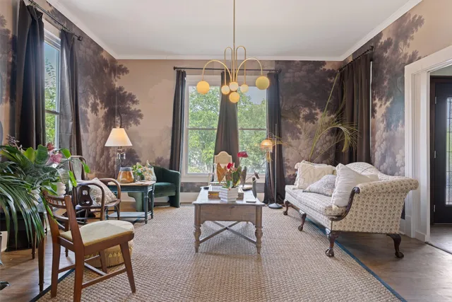 a living room with furniture and a large window